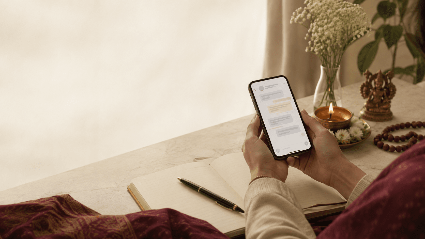 Person using a phone to arrange seva in India from abroad